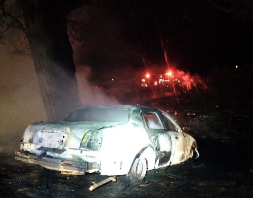 Two Suspects Charged with Multiple Felonies After Car Chase Ends in Flames