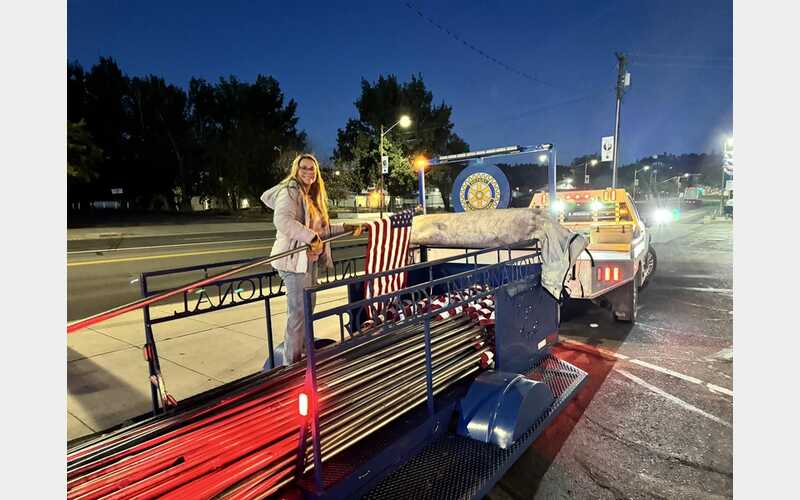 Rotarians Line Main Street with Flags for Patriot Day